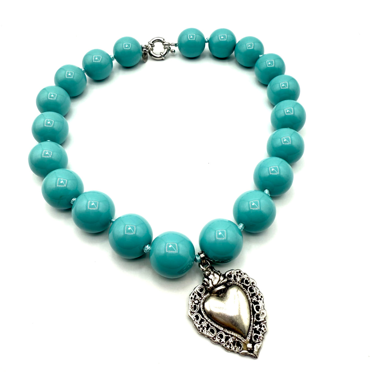 Collana Resina Turchese scuro e cuore sacro