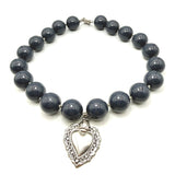 Collana Resina Grigio fumè e Cuore Sacro