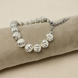 Bracciale con cuscino chiaro, seconda foto