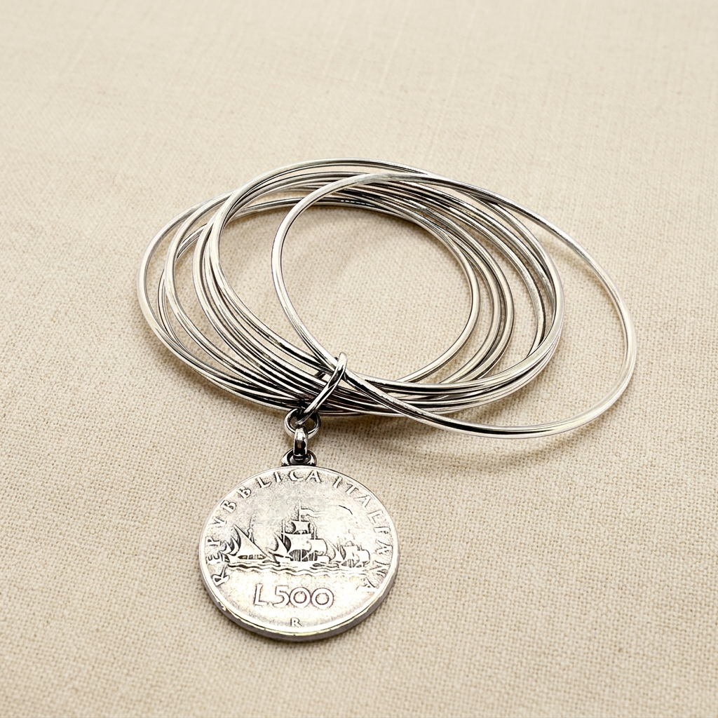 Bracciale rigido 6 fili con moneta 500 lire su lino beige