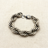 Bracciale Torcione Ottone Argento Antico su lino beige