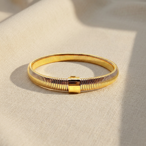 Bracciale Tubogas Dorato su lino beige